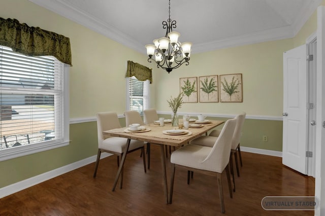 dining area with dark wood-style floors, a chandelier, baseboards, and ornamental molding