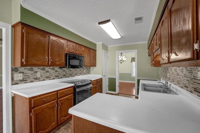 kitchen with visible vents, black microwave, a peninsula, electric range, and a sink