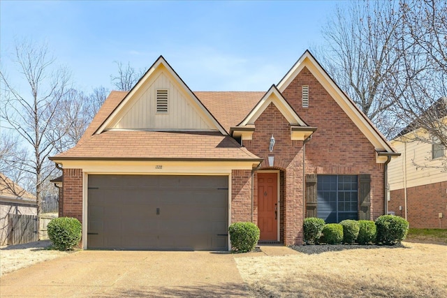 view of front of property featuring board and batten siding, brick siding, a garage, and driveway