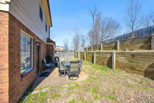 view of yard featuring a patio and a fenced backyard