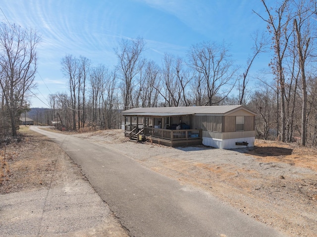 manufactured / mobile home with covered porch and driveway