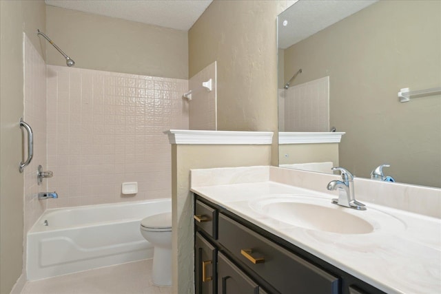 bathroom with tile patterned floors, toilet, a textured ceiling, tub / shower combination, and vanity