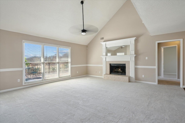 unfurnished living room featuring a brick fireplace, a ceiling fan, baseboards, and carpet floors