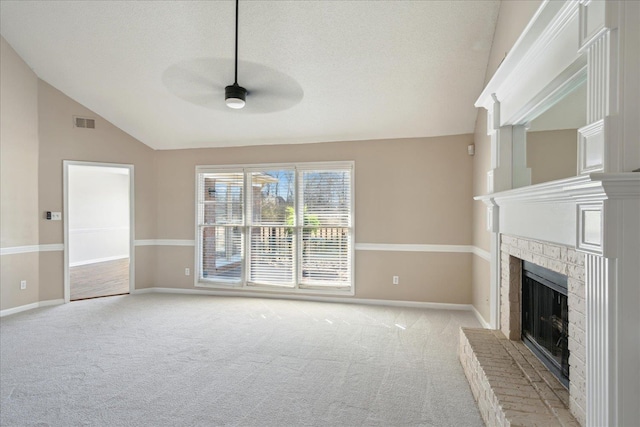 unfurnished living room with a fireplace, vaulted ceiling, light colored carpet, and baseboards