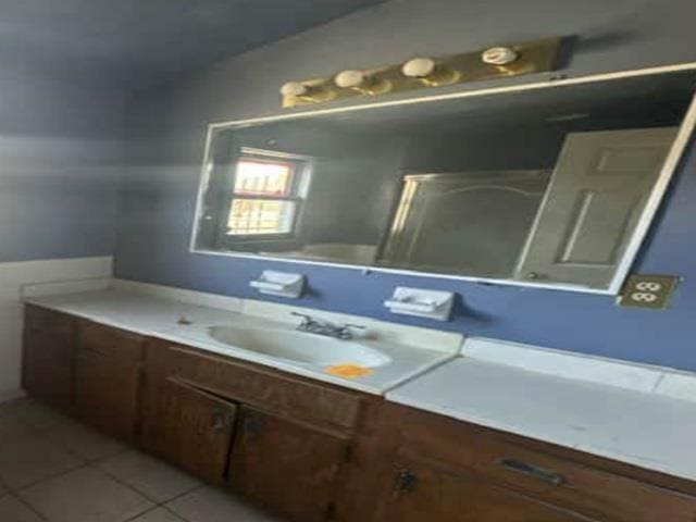 bathroom with tile patterned flooring and vanity