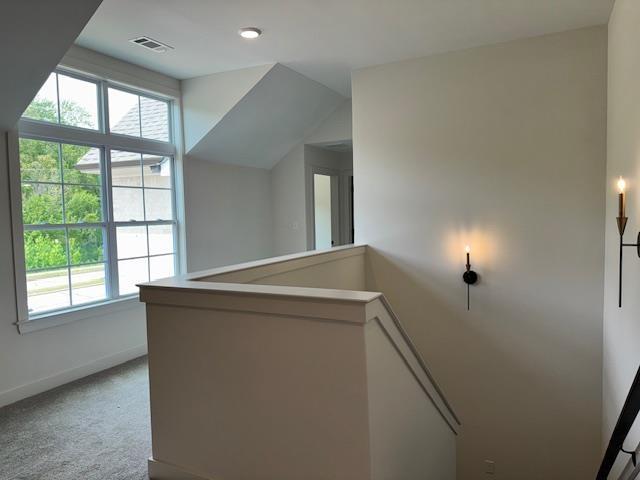 5876 Milton Wilson Blvd, Arlington, TN 38002 - corridor featuring carpet floors, baseboards, visible vents, and an upstairs landing