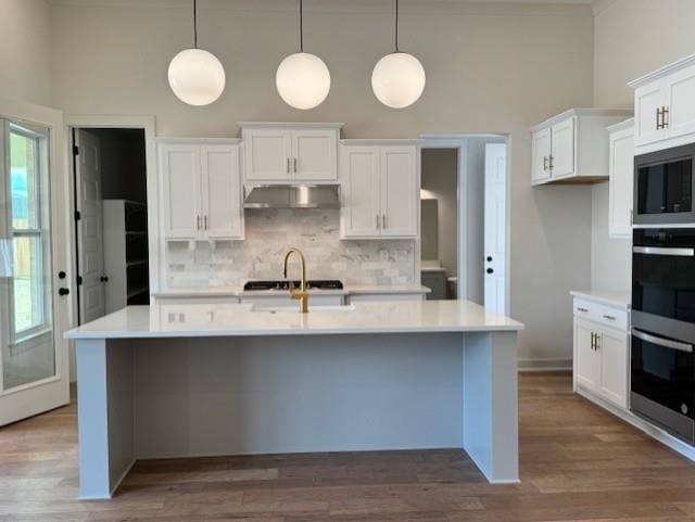 5876 Milton Wilson Blvd, Arlington, TN 38002 - kitchen with light countertops, tasteful backsplash, built in microwave, and double oven