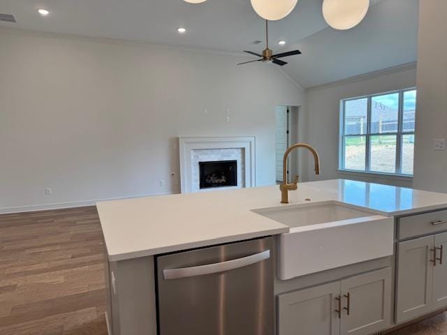 5876 Milton Wilson Blvd, Arlington, TN 38002 - kitchen featuring stainless steel dishwasher, open floor plan, light countertops, a sink, and vaulted ceiling