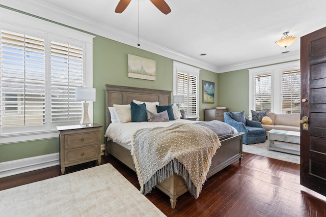 bedroom with a ceiling fan, crown molding, dark wood-style floors, and baseboards