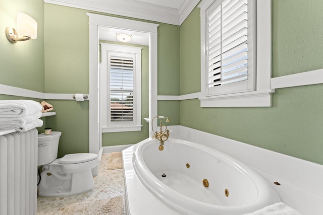 full bath featuring toilet, a tub with jets, ornamental molding, and radiator heating unit