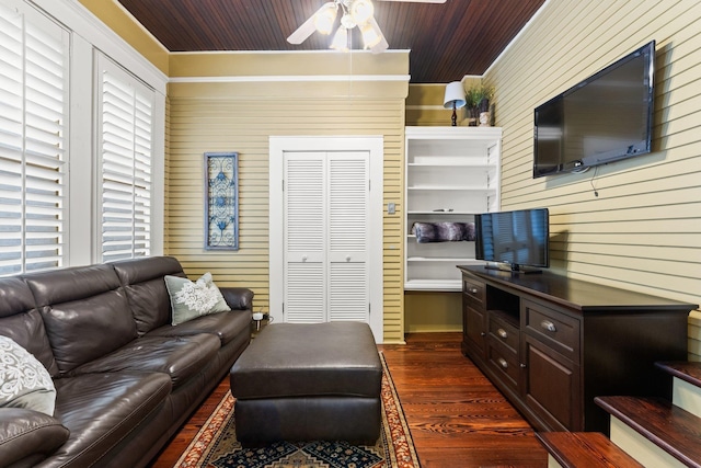 living room featuring wooden walls, a ceiling fan, dark wood-style floors, and wooden ceiling