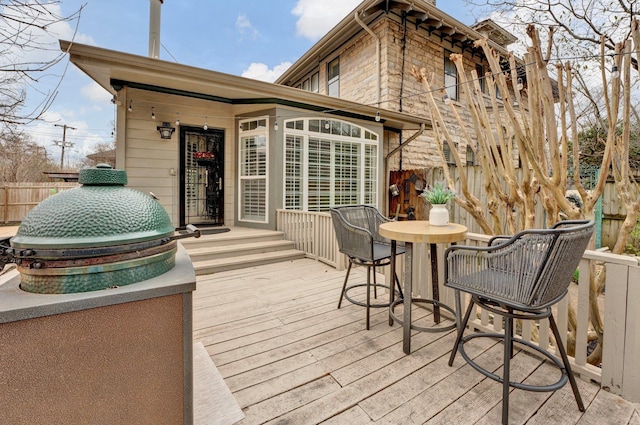 wooden deck featuring fence