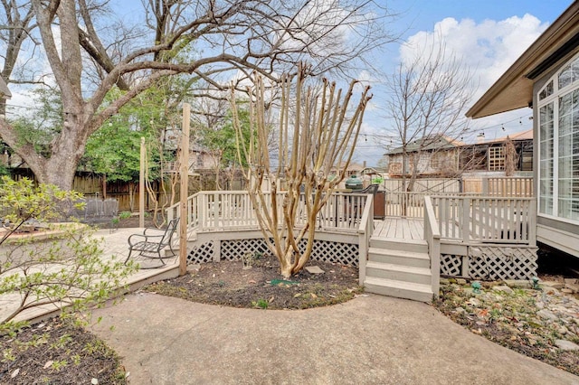 deck featuring a patio and fence