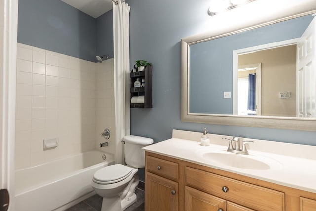 bathroom featuring shower / bathing tub combination, toilet, vanity, and tile patterned flooring