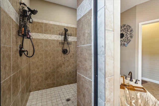 full bath featuring a tile shower