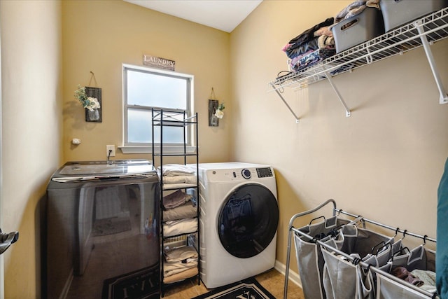 washroom with washer and dryer and laundry area