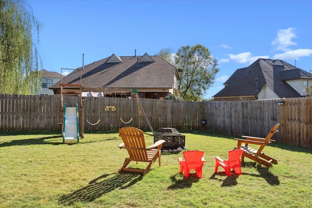 view of yard featuring an outdoor fire pit and a fenced backyard