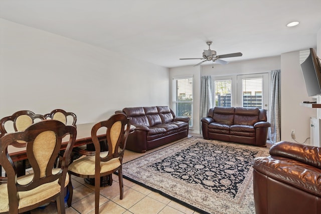 living room with light tile patterned floors and a ceiling fan