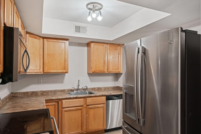 kitchen with visible vents, appliances with stainless steel finishes, and a sink