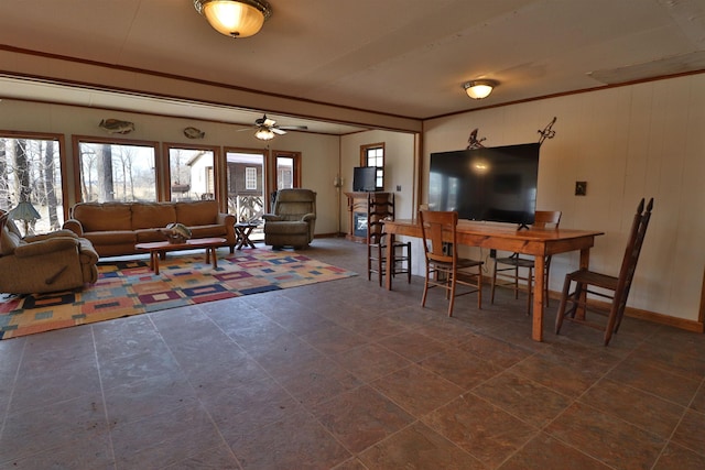 dining room featuring crown molding and baseboards