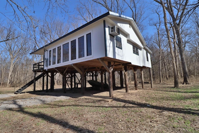 exterior space with stairway and a carport