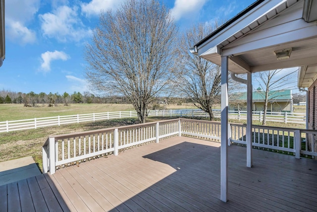 wooden deck featuring a rural view and fence