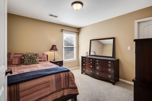 bedroom featuring light colored carpet, visible vents, and baseboards