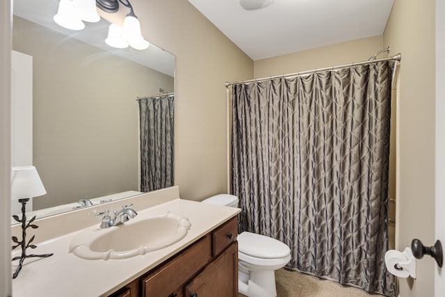 bathroom with tile patterned floors, curtained shower, toilet, and vanity