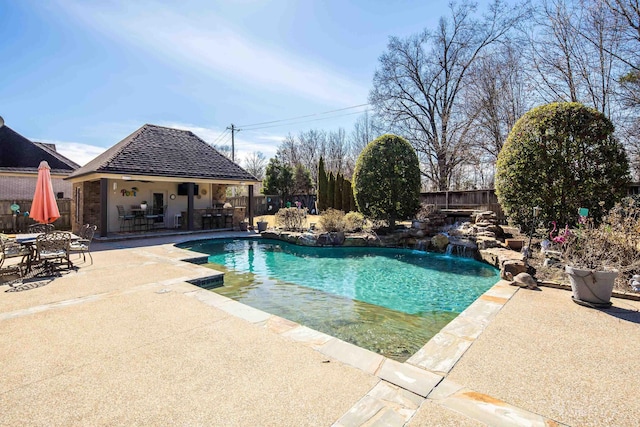 view of swimming pool with a patio area, a fenced in pool, and a fenced backyard