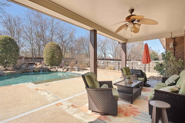 view of patio / terrace featuring ceiling fan, a fenced in pool, an outdoor hangout area, and a fenced backyard