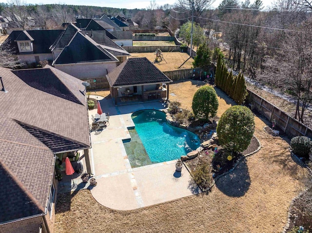 view of swimming pool with a patio area, a fenced in pool, and a fenced backyard