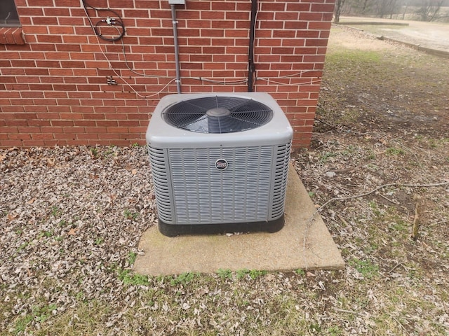 exterior details with brick siding and cooling unit