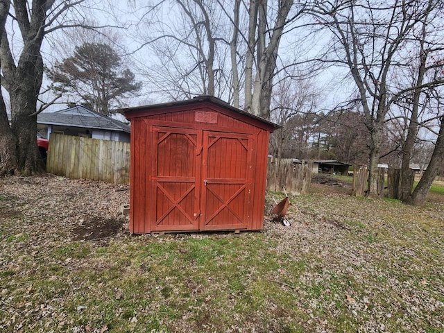 view of shed with fence