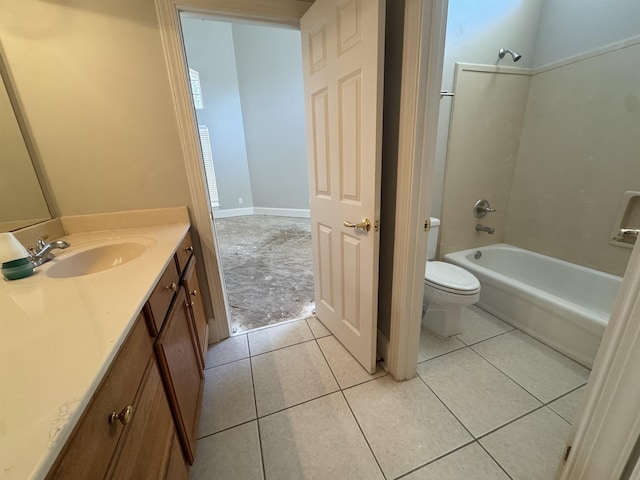 full bath featuring tile patterned flooring, toilet, vanity, and washtub / shower combination