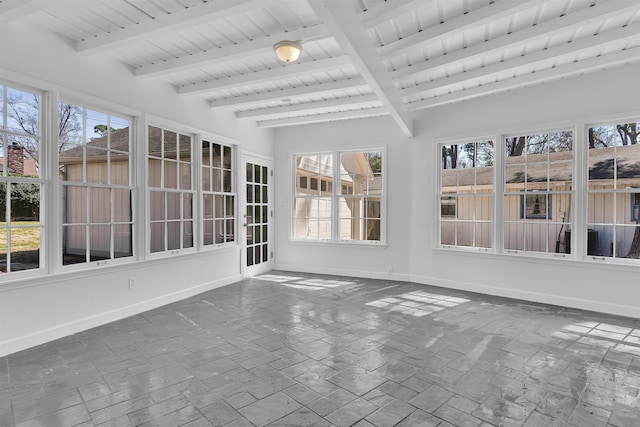 unfurnished sunroom with beamed ceiling and wood ceiling