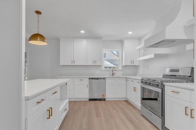 kitchen featuring light wood finished floors, open shelves, appliances with stainless steel finishes, custom exhaust hood, and a sink