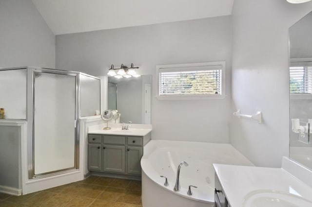 full bath with tile patterned flooring, a shower stall, a jetted tub, and two vanities