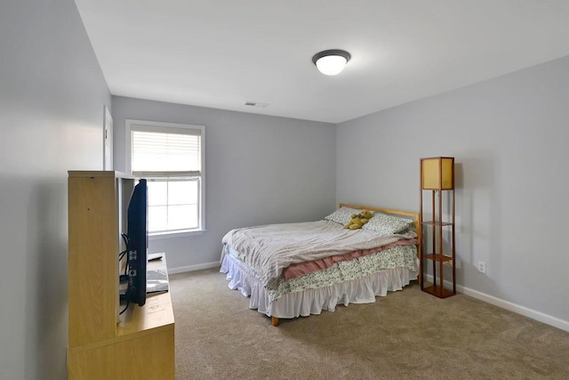 bedroom with visible vents, baseboards, and carpet floors