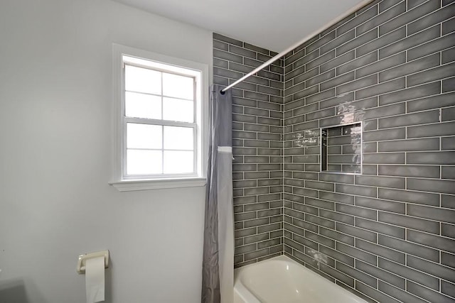 bathroom with shower / bath combination with curtain