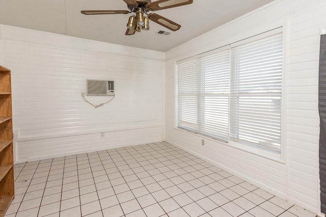 spare room featuring ceiling fan, visible vents, ornamental molding, and a wall mounted AC