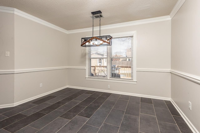 unfurnished dining area with visible vents, baseboards, a textured ceiling, and crown molding