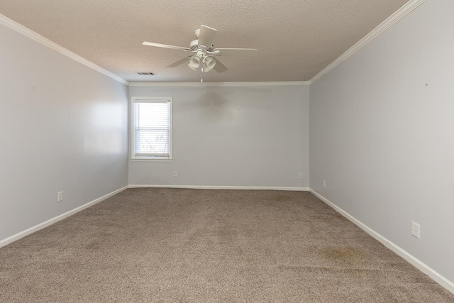 unfurnished room featuring visible vents, ceiling fan, baseboards, ornamental molding, and a textured ceiling