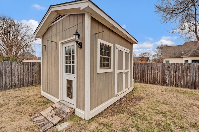 view of shed featuring a fenced backyard