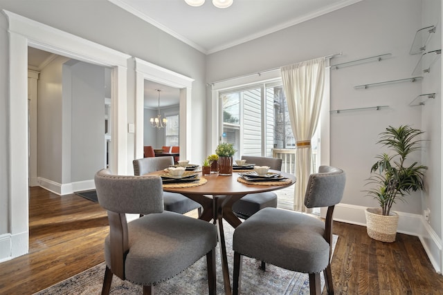 dining area with baseboards, an inviting chandelier, ornamental molding, and dark wood finished floors