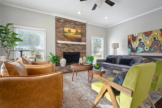 living room with recessed lighting, a fireplace, crown molding, and ceiling fan