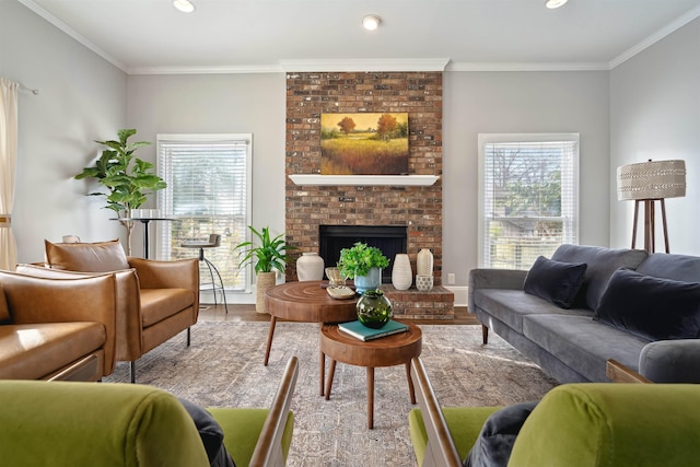 living area with recessed lighting, ornamental molding, a fireplace, and wood finished floors