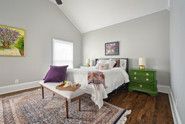 bedroom featuring dark wood-style floors, crown molding, baseboards, and vaulted ceiling