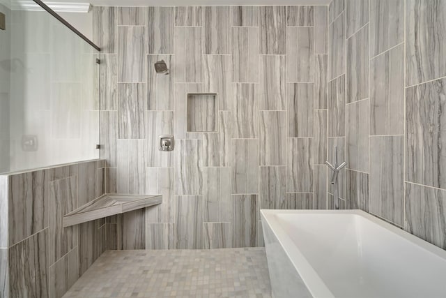 full bath featuring a tile shower