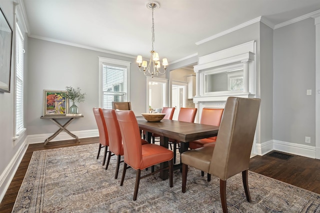 dining space featuring a notable chandelier, baseboards, dark wood-type flooring, and ornamental molding