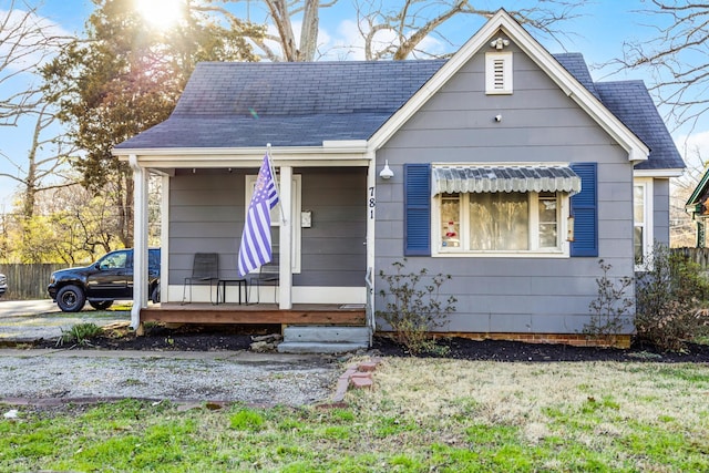 bungalow-style house featuring roof with shingles